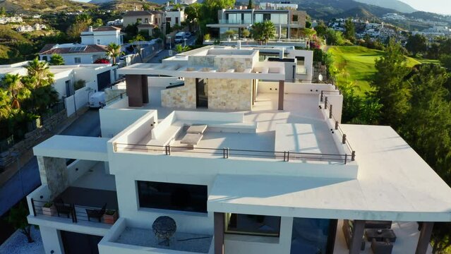 Drone Over Luxury Property With Infinity Pool At Sunrise
