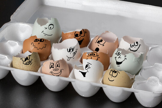 Fun and playful conceptual image depicting multi racial relationships through the use of various colored eggs with funny comical faces