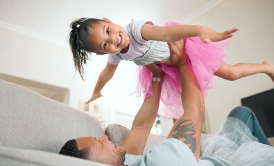 Look, Im a plane. Shot of an adorable little girl bonding with her father in the living room at home.