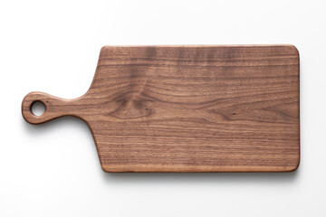 Handmade black walnut wood cutting board on white background. Handmade wooden chopping board....