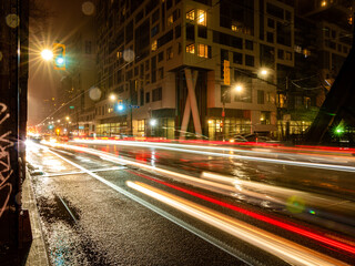 Fototapeta na wymiar Busy downtown traffic at night
