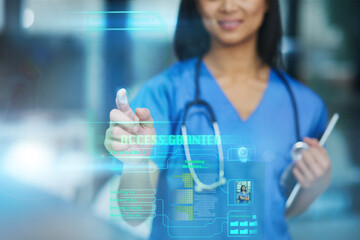 Obraz premium New technology leads to medical advances. Cropped shot of an unrecognizable female nurse using a touchscreen interface while standing in the hospital.