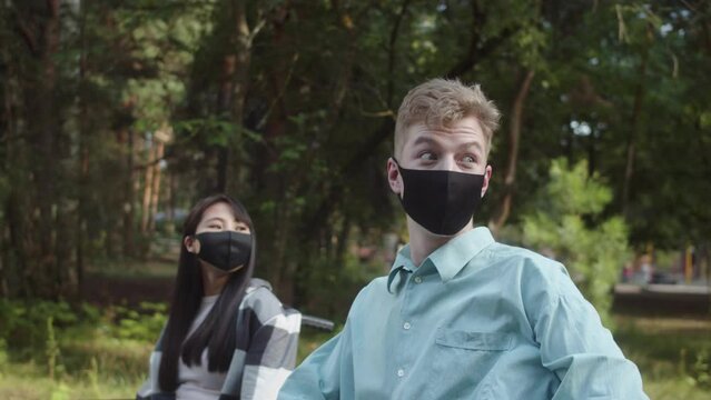 Two disabled friends are walking in the forest, meeting their friends and talking with them