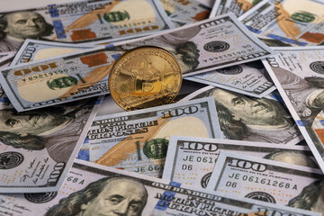 golden bitcoin coin on us dollars 