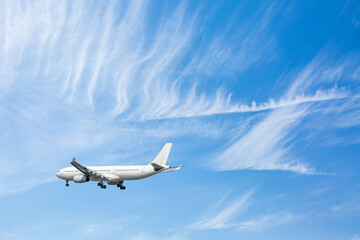 Fototapeta na wymiar Airplane flying in blue sky. travel concept.