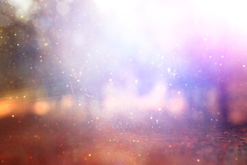 blurred abstract photo of light burst among trees and glitter bokeh lights