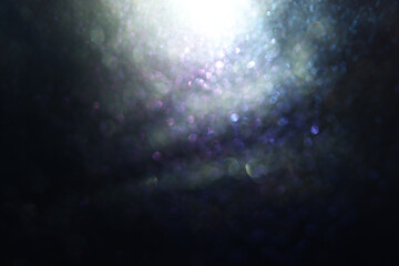 background of abstract glitter lights. silver, blue and black. de focused