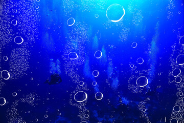 ocean underwater rays of light background, under blue water sunlight
