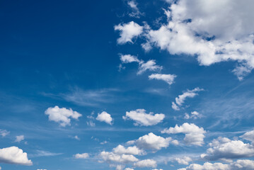 White cumulus clouds in blue sky, beautiful cloudscape background