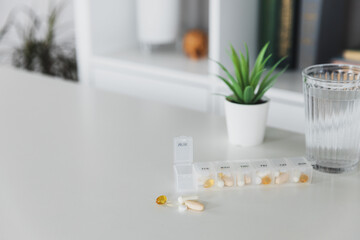 Closeup of medical pill box with doses of tablets for daily take a medicine for treatment, cure the...