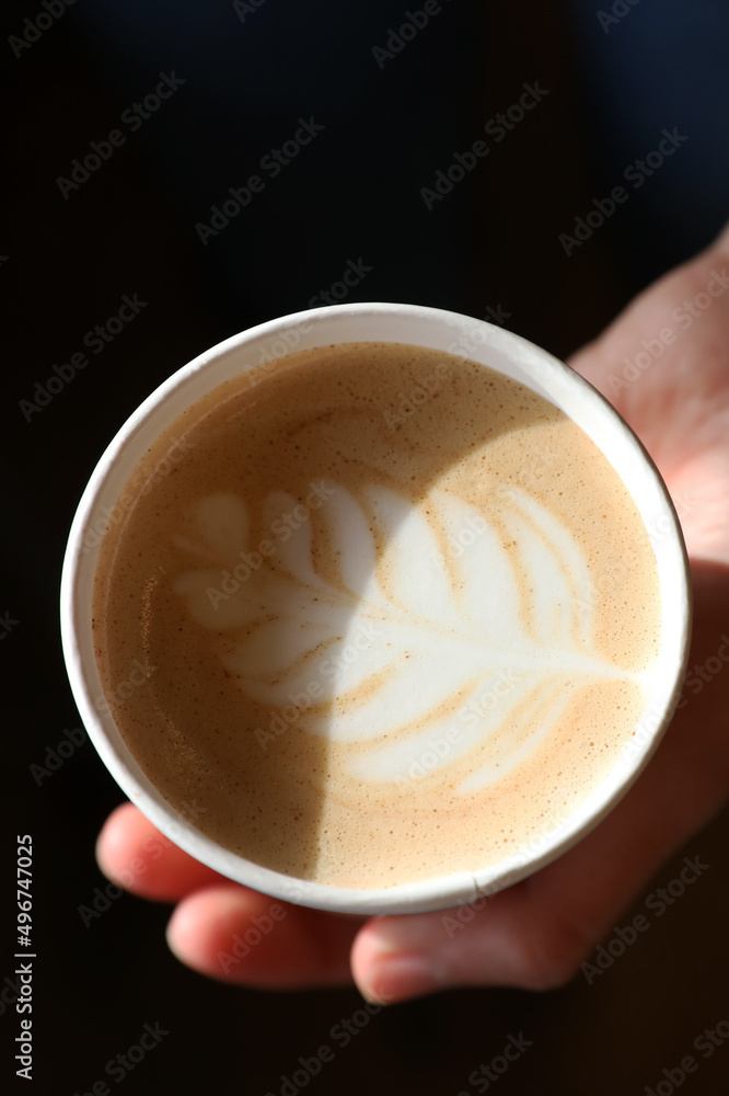 Sticker barista prepares coffee in a paper cup