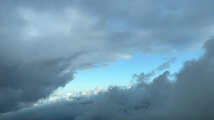 Flying toward a gap between the clouds