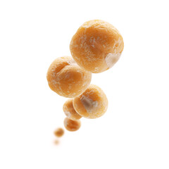 Dry yellow peas levitate on a white background