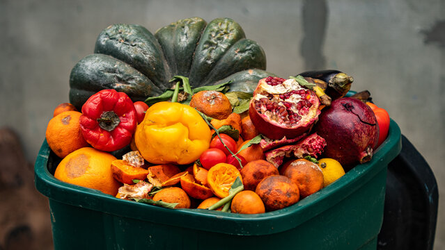 Spoiled unsold fruits and vegetables in the trash. Losses in retail, food waste