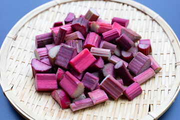 Fresh rhubarb in bamboo plate