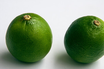 Close-up of lime on white background. Copy space concept