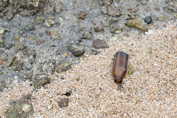 garbage on the beach, dirty sea