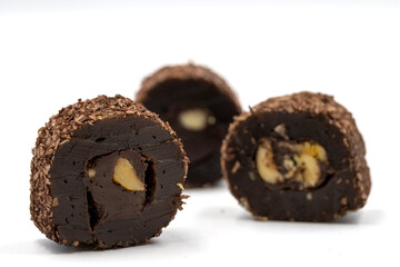 Turkish delight with hazelnut isolated on white background. Turkish delight with chocolate in the middle filled with hazelnut particles. close up