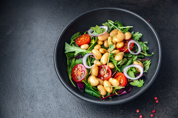 salad bean tomato, onion, lettuce leaves mix fresh healthy meal diet snack on the table copy space food background keto or paleo diet veggie vegan or vegetarian food