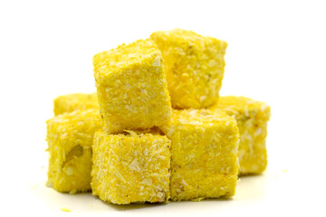 Turkish Delight Pistachio and Saffron Wick isolated on a white background. Close-up. Traditional Turkish cuisine delicacies.