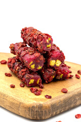 Turkish Delight Pistachio Pomegranate Fingers with Barberries isolated on a white background. Close-up pistachio Turkish delight. Traditional Turkish cuisine delicacies. Local name Zeresk lokum