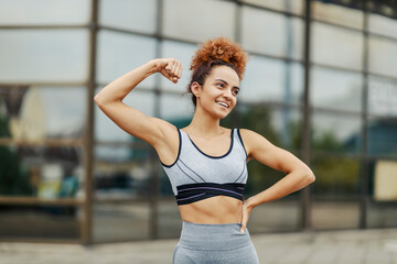 A sportswoman showing biceps.