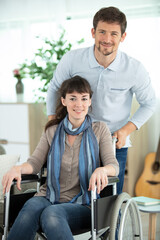 happy loving man and disabled woman at home