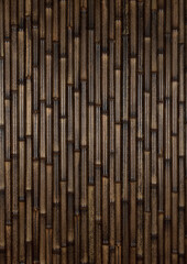 Textural detail of vertical dark brown bamboo close-up