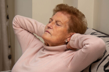 Obraz premium Woman relaxing and sleeping on the couch at home