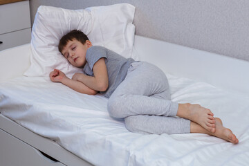 Charming boy sleeping in bed. Rest, sleep. - 496759645