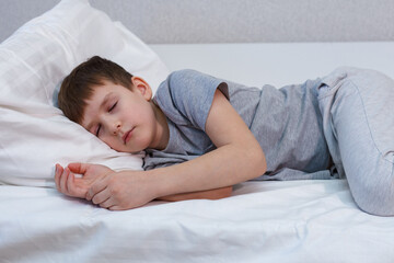 Charming boy sleeping in bed. Rest, sleep. - 496759646