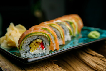 Thai food, rolls and sauce on wooden table