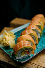 Thai food, rolls and sauce on wooden table