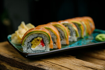 Thai food, rolls and sauce on wooden table