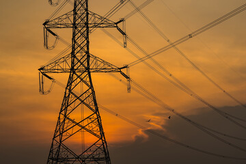 high voltage post,High voltage tower sky sunset background.