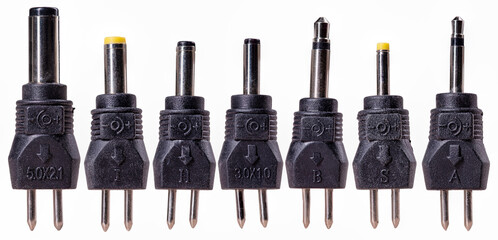 Various types of laptop charger tips.