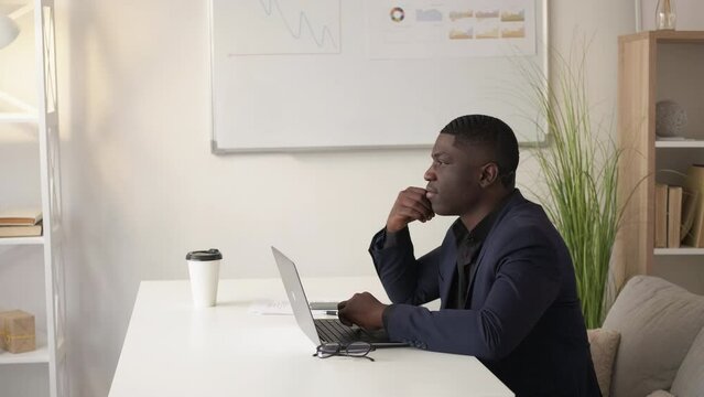 Business thinking. Startup development. Project planning. Pensive thoughtful man executive visualizing marketing offer at office workplace copy space.