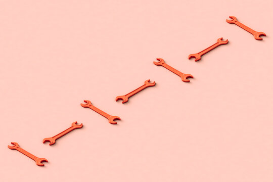 Three dimensional render of row of orange colored wrenches flat laid against beige background
