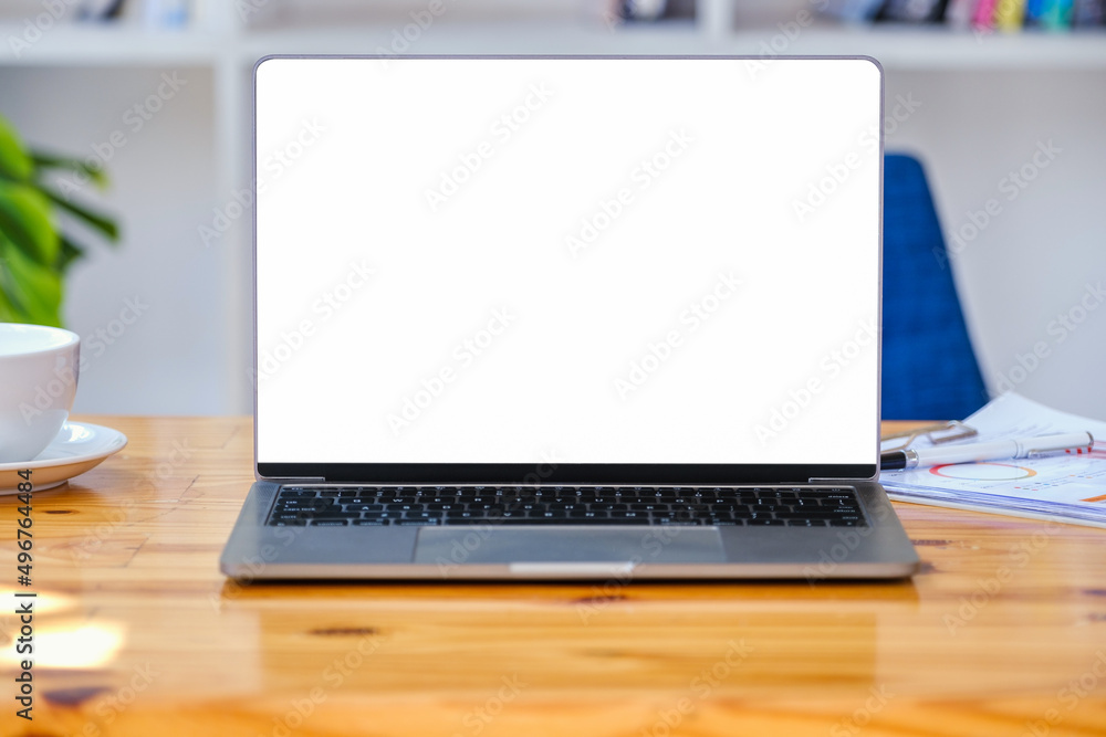 Poster a white screen computer on a wooden table can carry text messages or images on a blank screen.