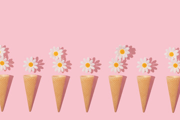 Spring creative pattern with white flower heads and ice cream cone on pastel pink background. 80s, 90s retro romantic aesthetic summer concept. Minimal surreal fashion idea.