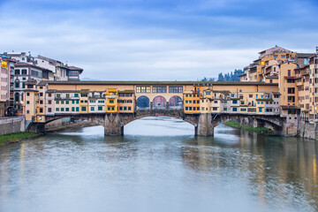 River Arno and famous bridge Ponte Vecchio at sunset from Ponte alle Grazie in Florence, Tuscany, Italy