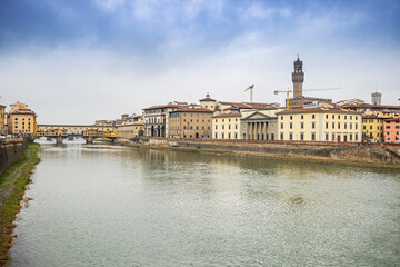 River Arno and famous bridge Ponte Vecchio at sunset from Ponte alle Grazie in Florence, Tuscany, Italy