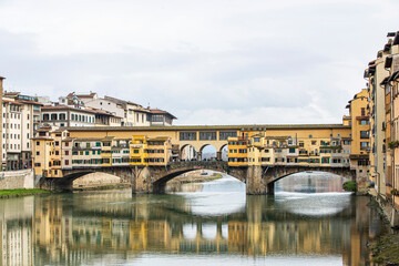 River Arno and famous bridge Ponte Vecchio at sunset from Ponte alle Grazie in Florence, Tuscany, Italy