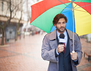 And it looks like rain today folks. A smiling weatherman reporting from an urban area.