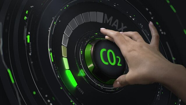 Reducing carbon dioxide emission trace. The hand moves the CO2 reduction handle. Abstract concept.