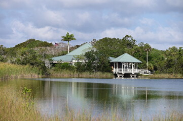 Ernest F Coe Visitor Center in Everglades National Park, Florida from Main Park Road on sunny spring morning.. - obrazy, fototapety, plakaty