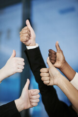 Great job. Shot of a group of hands showing thumbs up.
