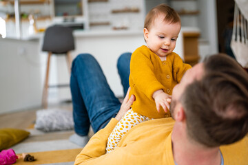 Naklejka premium Daddy and his little girl spending time at home. Single dad fun love family lifestyle concept