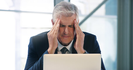 And thats when his day just started turning grey. Shot of a mature businessman looking stressed out...