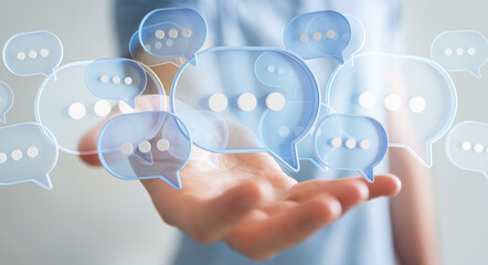 Businessman using digital speech bubbles talk icons. Minimal conversation or social media messages...